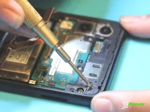 Replacing Screw on Samsung Z Flip 3 Cell Phone
